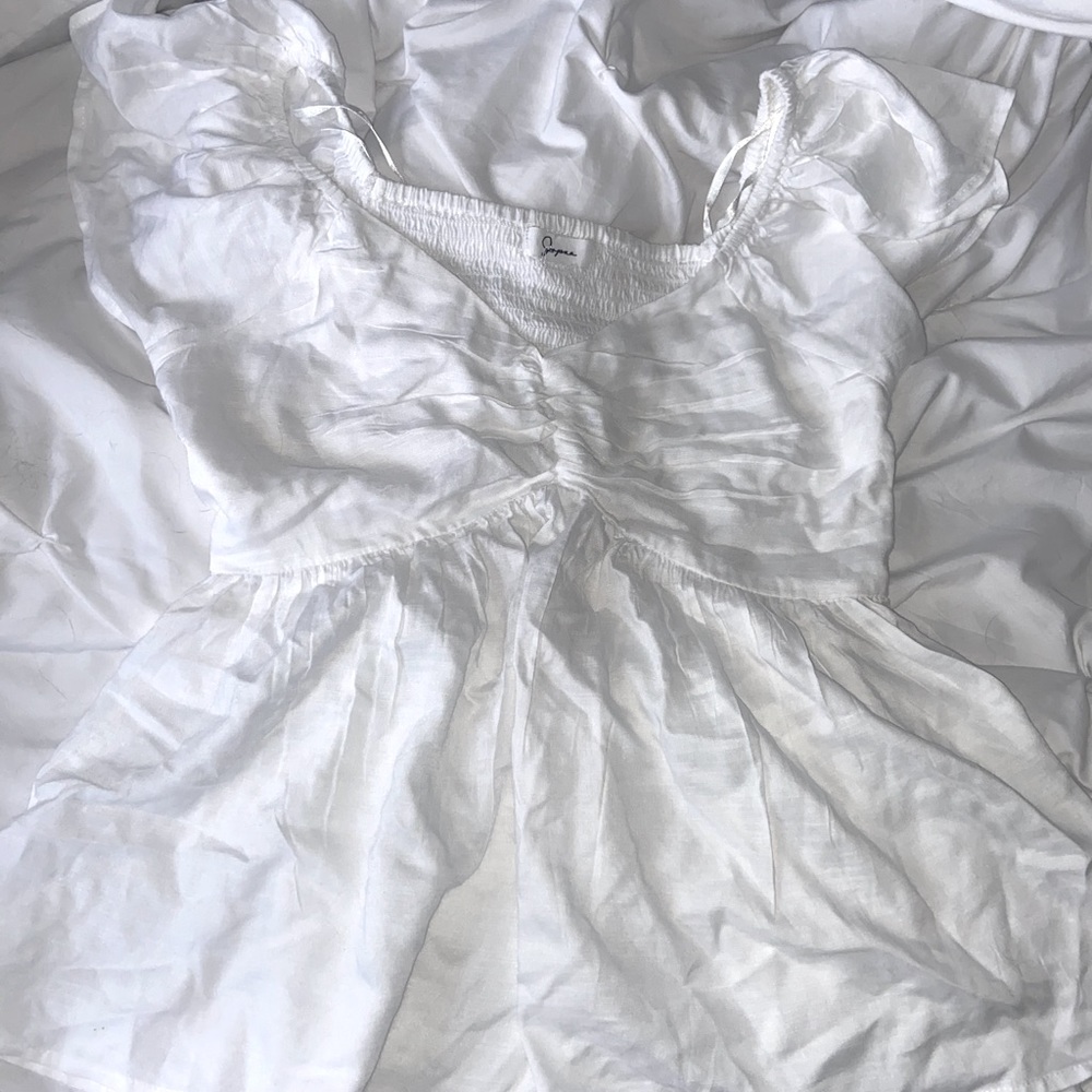 White flowy top